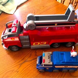Two Paw Patrol Trucks One Large One Small With One Figure